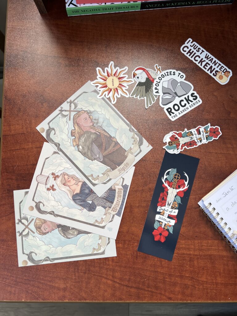a selection of book swag that might be included in a book club packet