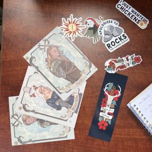 a selection of book swag that might be included in a book club packet